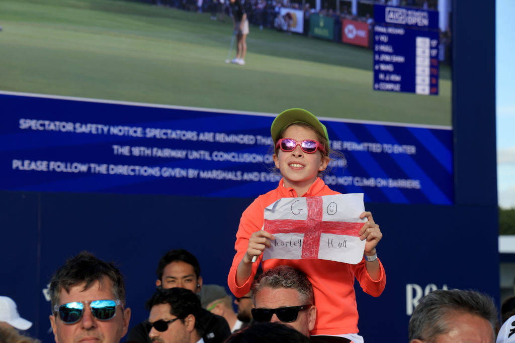 A fan shows a banner of support for Charley Hull at Walton Heath
